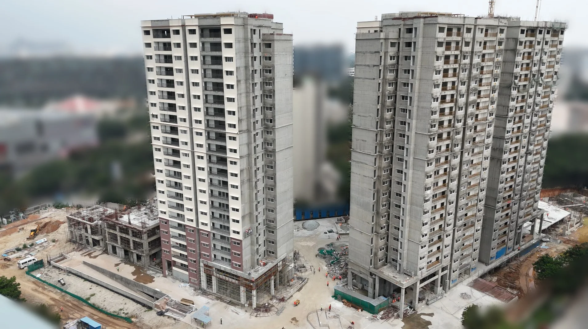 Drone view of two residential towers under construction